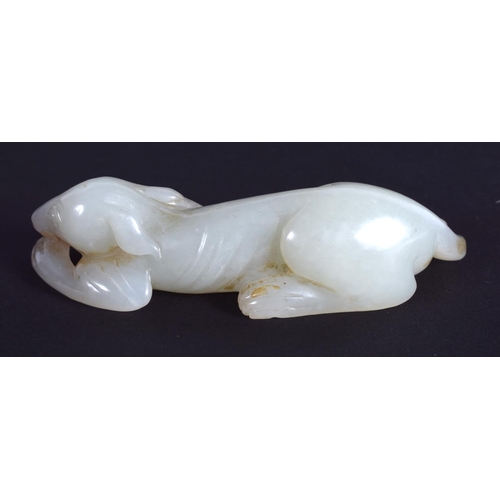 1239 - AN EARLY 20TH CENTURY CHINESE CARVED GREENISH WHITE JADE HOUND Late Qing/Republic. 7.25 cm wide.