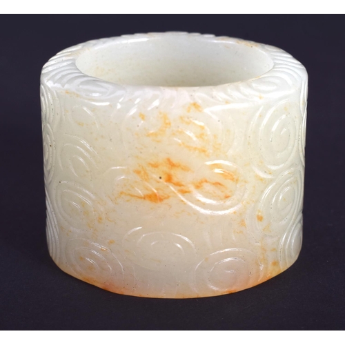 1241 - AN EARLY 20TH CENTURY CHINESE GREEN JADE ARCHERS RING Late Qing/Republic. 3.25 cm wide.