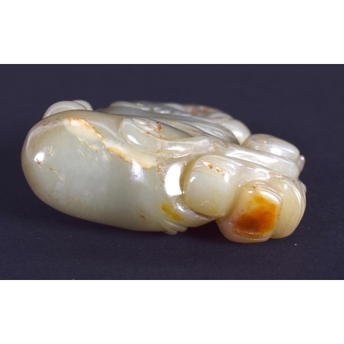 1242 - AN EARLY 20TH CENTURY CHINESE CARVED GREEN JADE FIGURE Late Qing/Republic. 6 cm x 4.25 cm.