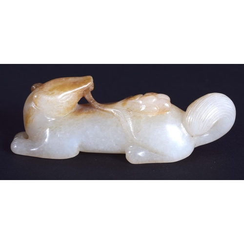 1272 - A CHINESE CARVED WHITE JADE FIGURE OF A STYLISED ANIMAL 20th Century. 5.5 cm wide.