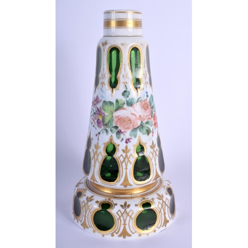 13 - A 19TH CENTURY BOHEMIAN ENAMELLED GREEN GLASS VASE painted with flowers and vines. 23.5 cm high.