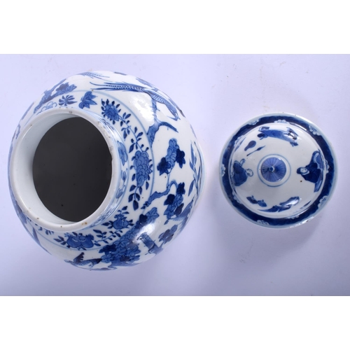 1334 - A 19TH CENTURY CHINESE BLUE AND WHITE VASE AND COVER bearing Qianlong marks to base. 23.5 cm high.