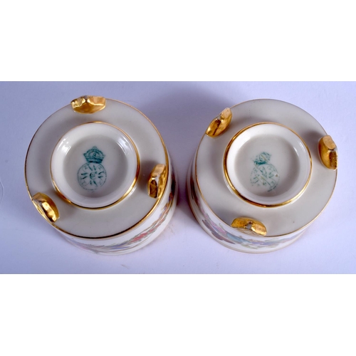 135 - A PAIR OF ANTIQUE ROYAL WORCESTER CIRCULAR SALTS painted with butterflies and foliage. 6 cm wide.