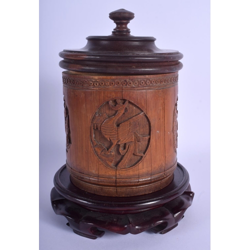 1359 - AN EARLY 20TH CENTURY CHINESE CARVED BAMBOO BRUSH POT Late Qing, with hongmu stand and cover. Bamboo... 