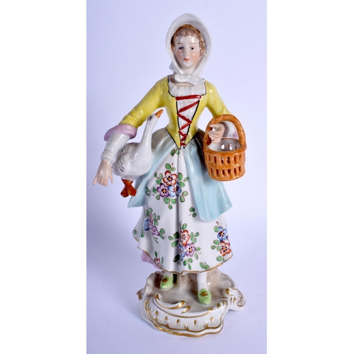 137 - AN EARLY 20TH CENTURY GERMAN PORCELAIN FIGURE OF A FEMALE modelled holding a swan. 20.5 cm high.