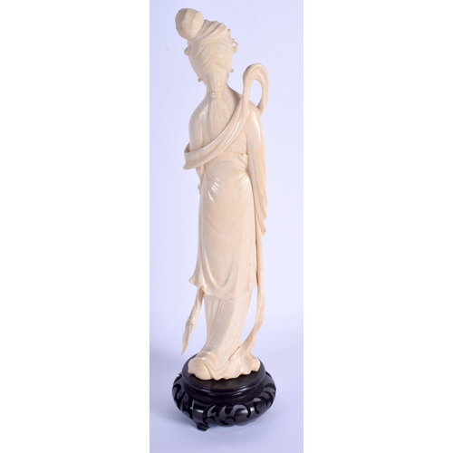 1370 - AN EARLY 20TH CENTURY CHINESE CARVED IVORY FIGURE OF A FEMALE Late Qing. Ivory 24.5 cm high.