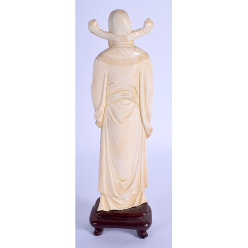 1371 - A SMALLER EARLY 20TH CENTURY CHINESE CARVED IVORY FIGURE OF A SCHOLAR modelled holding his belt. Ivo... 