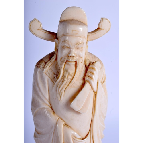 1371 - A SMALLER EARLY 20TH CENTURY CHINESE CARVED IVORY FIGURE OF A SCHOLAR modelled holding his belt. Ivo... 