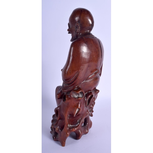 1373 - A 19TH CENTURY CHINESE CARVED HARDWOOD FIGURE OF A BUDDHA Qing, modelled holding a rui sceptre. 30 c... 