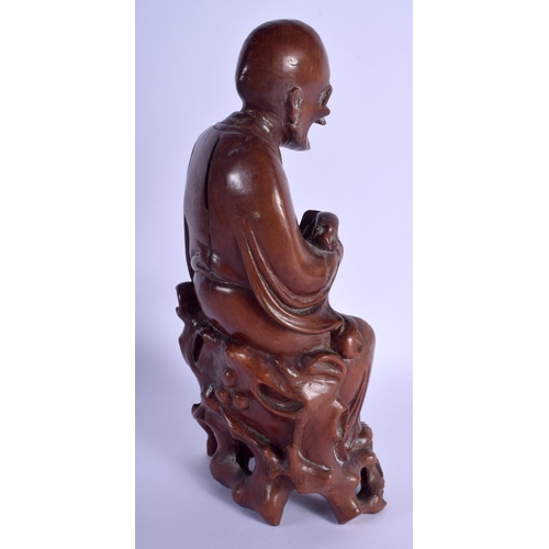 1373 - A 19TH CENTURY CHINESE CARVED HARDWOOD FIGURE OF A BUDDHA Qing, modelled holding a rui sceptre. 30 c... 