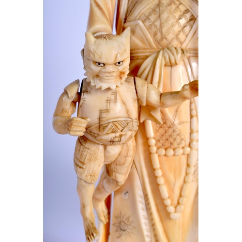 1377 - A PAIR OF 19TH CENTURY JAPANESE MEIJI PERIOD CARVED IVORY OKIMONO modelled holding temples & an oni.... 