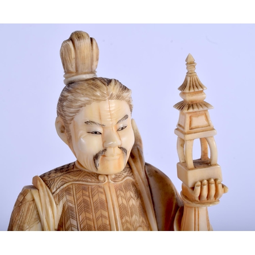 1377 - A PAIR OF 19TH CENTURY JAPANESE MEIJI PERIOD CARVED IVORY OKIMONO modelled holding temples & an oni.... 