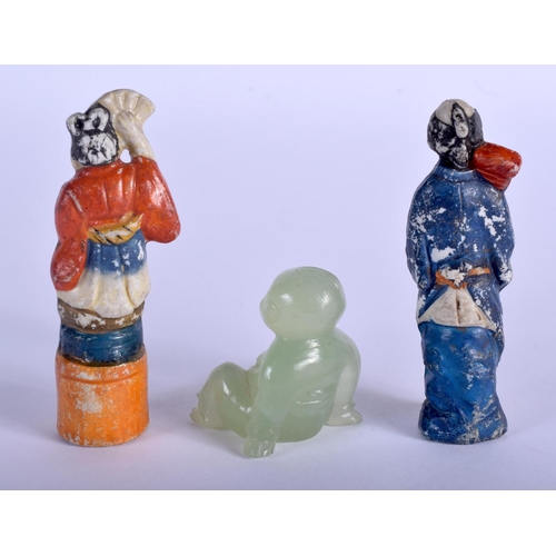 1379 - AN EARLY 20TH CENTURY CHINESE CARVED JADE BOY together with two other figures. (3)