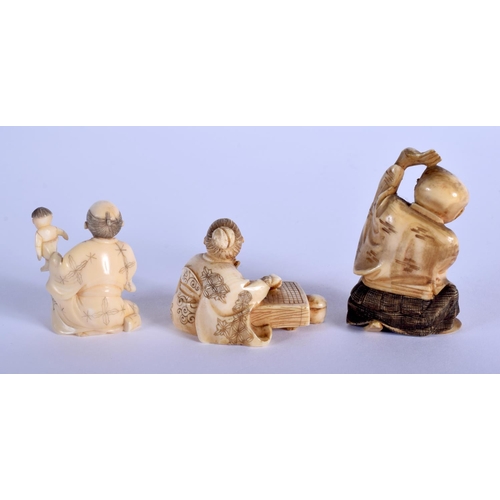 1382 - A 19TH CENTURY JAPANESE MEIJI PERIOD CARVED IVORY NETSUKE together with two other similar ivory okim... 