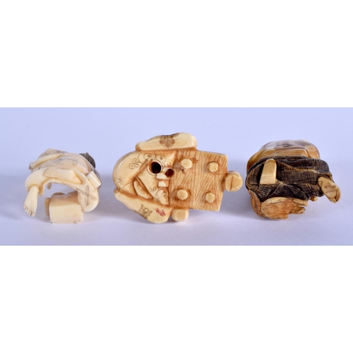 1382 - A 19TH CENTURY JAPANESE MEIJI PERIOD CARVED IVORY NETSUKE together with two other similar ivory okim... 