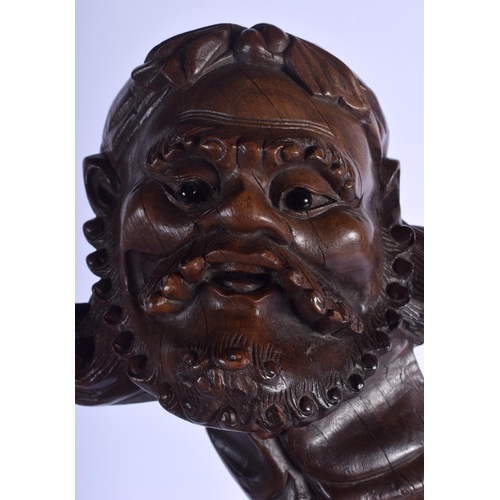 1386 - A 19TH CENTURY CHINESE CARVED HARDWOOD PORTRAIT HEAD OF A SCHOLAR Qing. 21 cm x 8 cm.