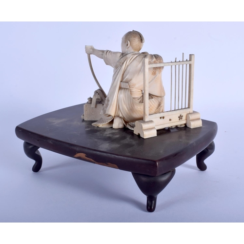 1393 - A RARE 19TH CENTURY JAPANESE MEIJI PERIOD CARVED IVORY ARCHER modelled seated beside an arrow stand.... 