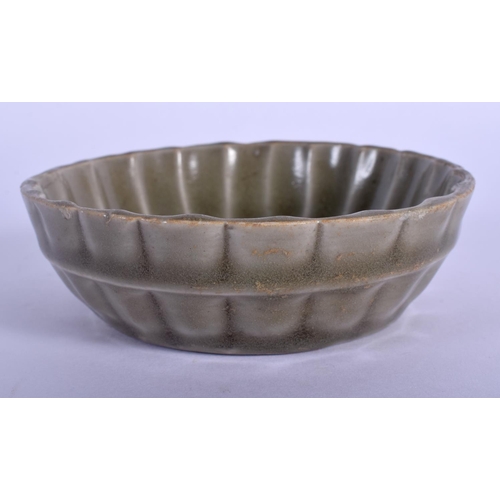 1403 - AN EARLY CHINESE YUAN/MING DYNASTY CELADON BRUSH WASHER of fluted form. 10 cm diameter.