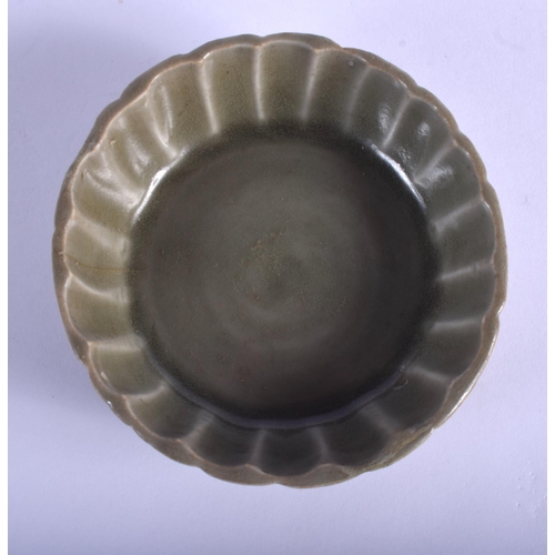 1403 - AN EARLY CHINESE YUAN/MING DYNASTY CELADON BRUSH WASHER of fluted form. 10 cm diameter.