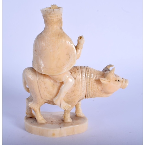 1406 - A 19TH CENTURY JAPANESE MEIJI PERIOD CARVED IVORY OKIMONO modelled as a male upon an ox. 12 cm high.