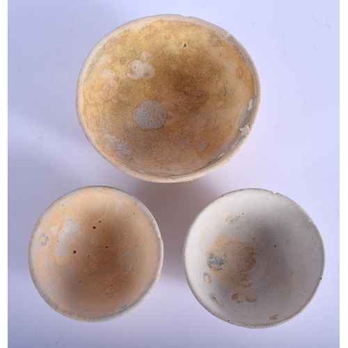 1410 - THREE 16TH/17TH CENTURY THAI SHIPWRECK POTTERY BOWLS. Largest 9 cm diameter. (3)