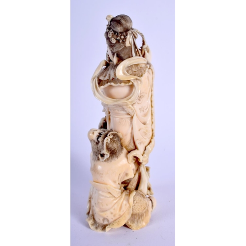 1462 - A 19TH CENTURY JAPANESE MEIJI PERIOD CARVED IVORY OKIMONO modelled as a female beside a monkey. 13.5... 