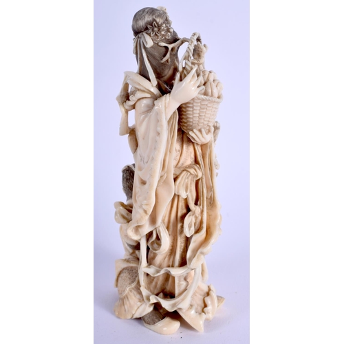 1462 - A 19TH CENTURY JAPANESE MEIJI PERIOD CARVED IVORY OKIMONO modelled as a female beside a monkey. 13.5... 