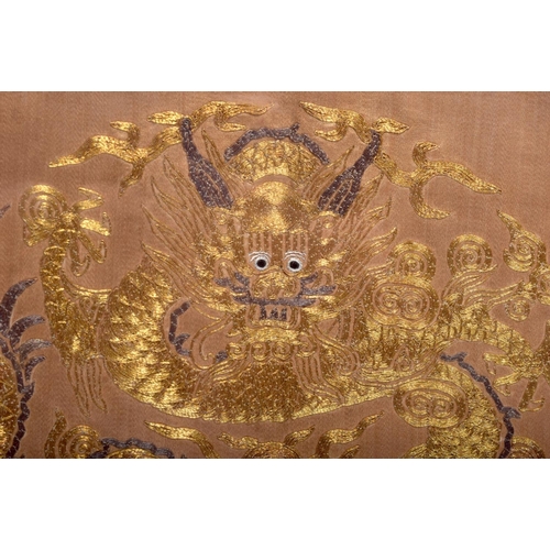 1502 - AN EARLY 20TH CENTURY CHINESE SILK WORK PANEL Late Qing, decorated with dragons. Silk 78 cm x 38 cm.