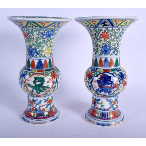 1505 - A PAIR OF 19TH CENTURY CHINESE WUCAI PORCELAIN GU SHAPED VASES Qing, bearing Wanli marks to base, to... 