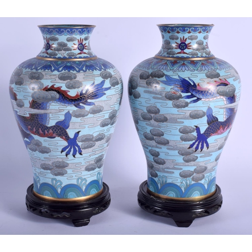 1514 - A LARGE PAIR OF CHINESE CLOISONNE ENAMEL VASES 20th Century, decorated with dragons and clouds. Vase... 