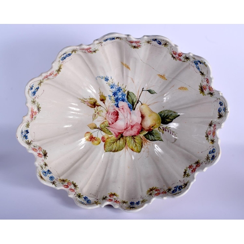 153 - A LARGE 18TH/19TH CENTURY EUROPEAN FAIENCE TIN GLAZED BOWL painted with flowers. 42 cm x 26 cm.