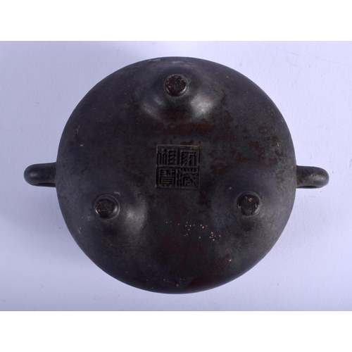 1538 - A CHINESE TWIN HANDLED BRONZE CENSER 20th century. 12.5 cm wide, internal width 7 cm.