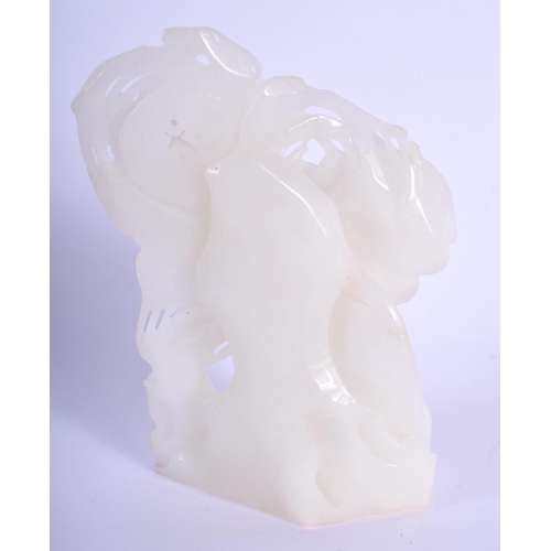 1548 - A CHINESE CARVED WHITE JADE NATURALISTIC GROUP 20th Century. 11 cm x 7 cm.