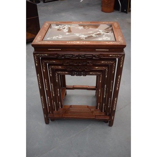 1566 - A NEST OF FOUR EARLY 20TH CENTURY CHINESE IVORY INLAID TABLES Late Qing. Largest 68 cm x 52 cm. (4)