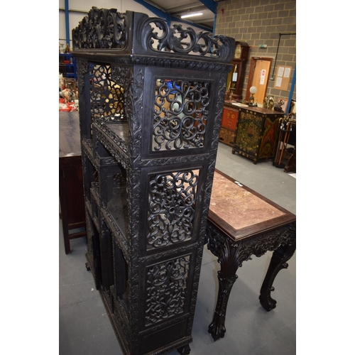 1567 - A LARGE 19TH CENTURY CHINESE CARVED HONGMU DISPLAY CABINET Qing, with profusely decoration frieze. 1... 