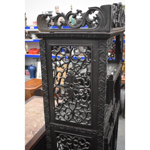 1567 - A LARGE 19TH CENTURY CHINESE CARVED HONGMU DISPLAY CABINET Qing, with profusely decoration frieze. 1... 