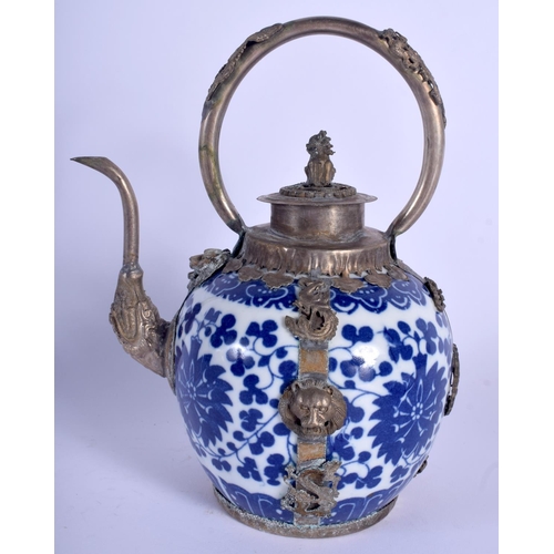 1577 - A CHINESE TIBETAN WHITE METAL MOUNTED PORCELAIN TEAPOT 20th Century. 13 cm x 19 cm.