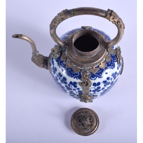 1577 - A CHINESE TIBETAN WHITE METAL MOUNTED PORCELAIN TEAPOT 20th Century. 13 cm x 19 cm.