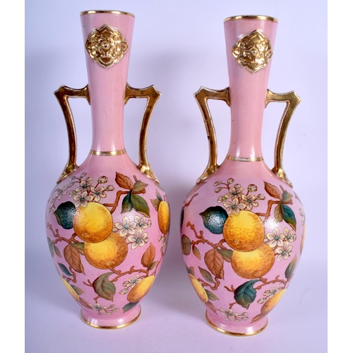 170 - A PAIR OF CONTINENTAL ARTS AND CRAFTS TWIN HANDLED VASES modelled in the Islamic stye. 34.5 cm high.