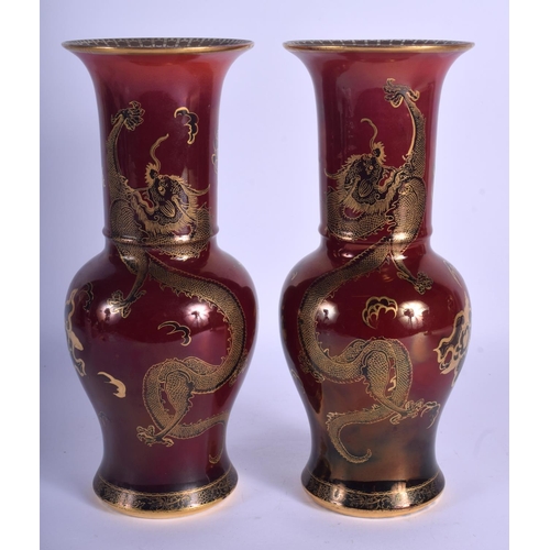 177 - A PAIR OF ART DECO CARLTON WARE ROUGE ROYALE VASES decorated with dragons. 29.5 cm high.