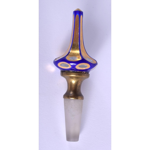 18 - A 19TH CENTURY BOHEMIAN GLASS SCENT BOTTLE AND STOPPER gilded with motifs. 22.5 cm high.