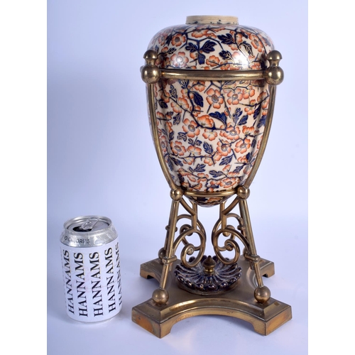 186 - A LARGE 19TH CENTURY CONTINENTAL IMARI STYLE EGG FORM VASE with stylised brass mounts. 35 cm high.