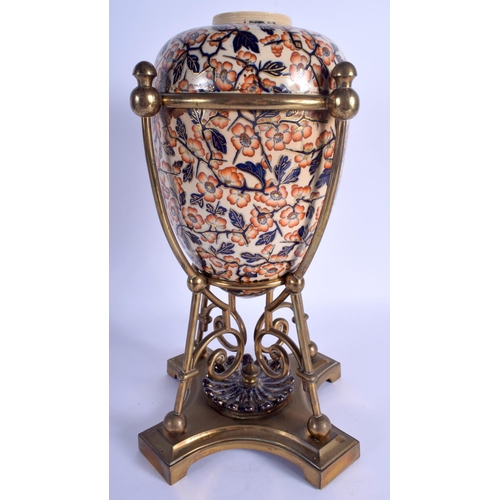 186 - A LARGE 19TH CENTURY CONTINENTAL IMARI STYLE EGG FORM VASE with stylised brass mounts. 35 cm high.