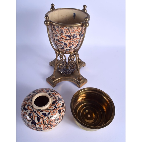 186 - A LARGE 19TH CENTURY CONTINENTAL IMARI STYLE EGG FORM VASE with stylised brass mounts. 35 cm high.