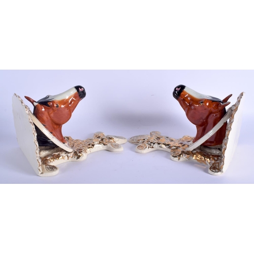 189 - A PAIR OF 19TH CENTURY CONTINENTAL LUSTRE EQUESTRIAN BRACKETS modelled as horses heads. 27 cm x 16 c... 