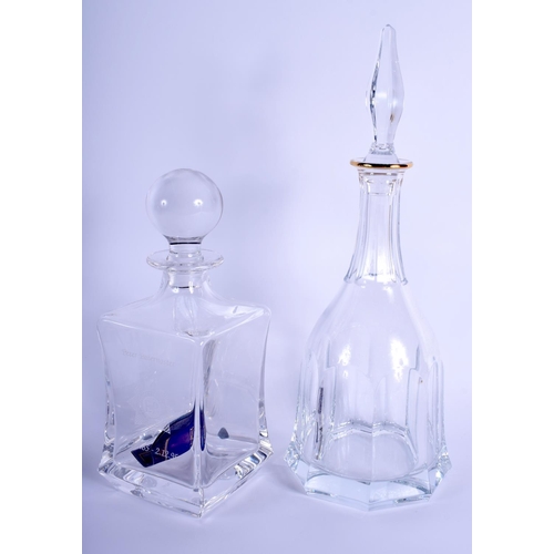 19 - A CZECH ROGASKA GLASS DECANTER AND STOPPER of facetted form, together with another. Largest 36 cm hi... 