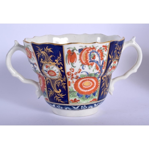 199 - Worcester fine caudle cup or chocolate, the two handled cup and deep saucer painted with a gilt imar... 