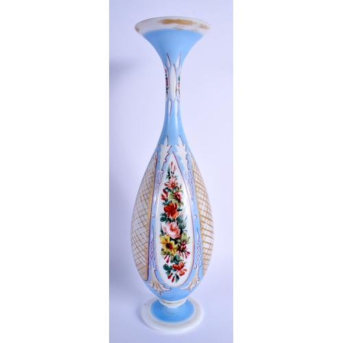 20 - AN ANTIQUE BOHEMIAN BLUE AND ENAMELLED OPALINE GLASS VASE painted with flowers. 36 cm high.