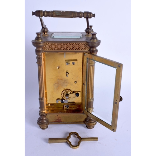 2011 - AN EARLY 20TH CENTURY FRENCH BRASS CARRIAGE CLOCK with circular enamelled dial. 16.5 cm high inc han... 