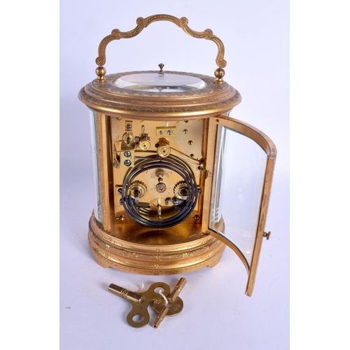 2017 - A LARGE ANTIQUE FRENCH OVAL REPEATING BRASS CARRIAGE CLOCK decorated with foliage. 21 cm high inc ha... 